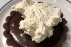 finish the tart with freshly whipped cream;  1 cup heavy cream, 2 Tablespoons confectioners' sugar and 1 teaspoon vanilla.  Whip until thick.  Perfection.