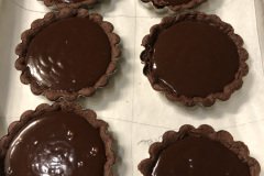 individual chocolate  truffle tarts.