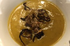 Butternut squash soup with frizzled shallots.