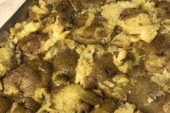 Smashed Yukon Gold potatoes ready for the oven.   We're looking for crispy on top and bottom and tender in the center.