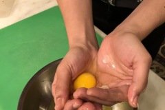 separating eggs for the pudding with smooth hands