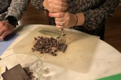 chopping chocolate bars with a chipper