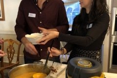Birthday  girl serving soup