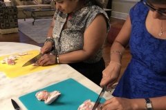 Two sisters learn to cook-disjointing chicken wings for asian styled barbecued wings