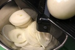Slicing onions on mandolin